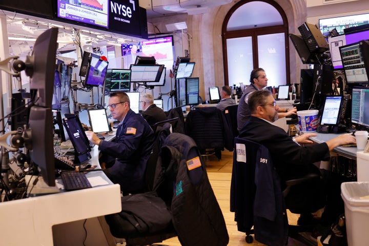 NEW YORK, NEW YORK - DECEMBER 13: Traders work on the floor of the New York Stock Exchange during morning trading on December 13, 2023 in New York City. (Photo by Michael M. Santiago/Getty Images)