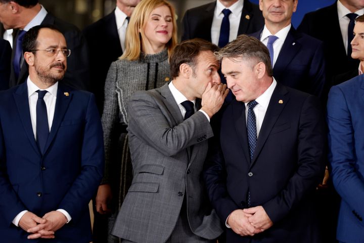 French President Emmanuel Macron, center left, speaks with Chairman of the Presidency of Bosnia and Herzegovina Zeljko Komsic during a group photo at an EU-Western Balkans summit in Brussels, Wednesday, Dec. 13, 2023. European Union and Western Balkans leaders meet in Brussels Wednesday to discuss political and policy engagement, economic foundations and the impact of Russian aggression against Ukraine. (AP Photo/Omar Havana)