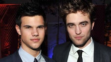 Taylor Lautner Recalls ‘Twilight’ Rivalry With Robert Pattinson Taylor Lautner Recalls ‘Twilight’ Rivalry With Robert Pattinson