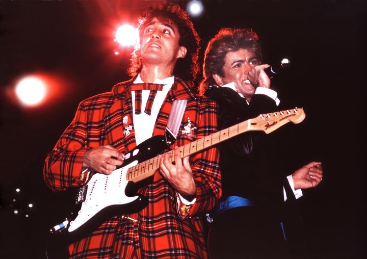 Andrew Ridgeley and George Michael of Wham! performing in 1984