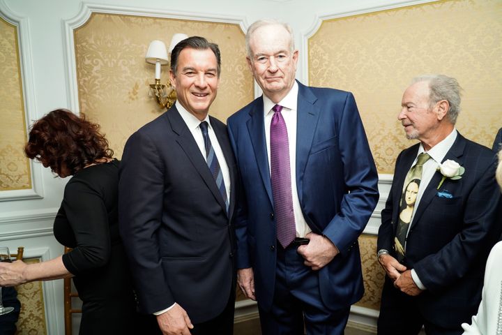 Former U.S. Rep. Tom Suozzi, left, poses with conservative pundit Bill O'Reilly at a 2022 charity event. In a race for a swing seat, Suozzi and Pilip both hope to wield crossover appeal.