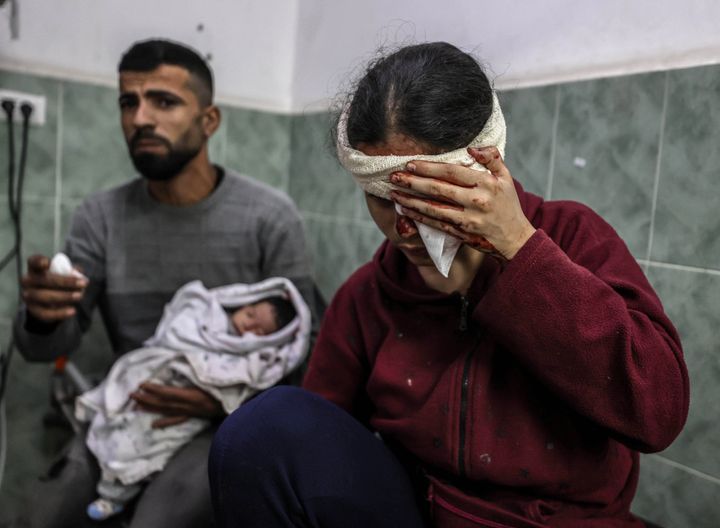 RAFAH, GAZA - DECEMBER 14: (EDITORS NOTE: Image depicts graphic content) Palestinians receive medical treatment at Mohammed Yousef El-Najar Hospital after getting injured in Israeli attacks in Rafah, Gaza on December 14, 2023. (Photo by Ali Jadallah/Anadolu via Getty Images)