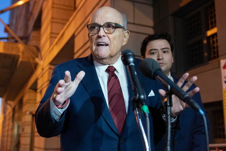 Former New York Mayor Rudy Giuliani talks to reporters Dec. 11 as he leaves the federal courthouse in Washington, D.C.