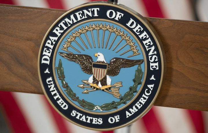 The seal of the Defense Department is seen.