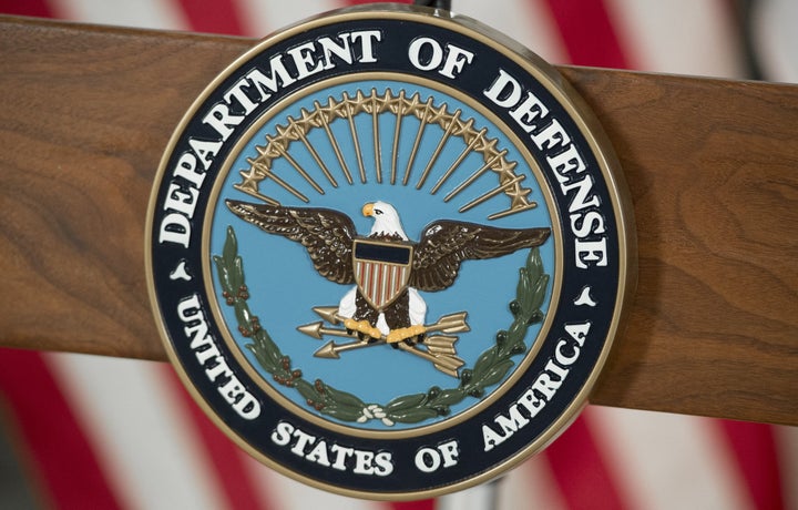 The seal of the Defense Department is seen.