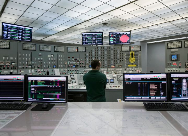 In this Nov. 29, 2016, photo, reactor operator Patrick Ryan works in a control room at Nine Mile Point in Oswego, New York.