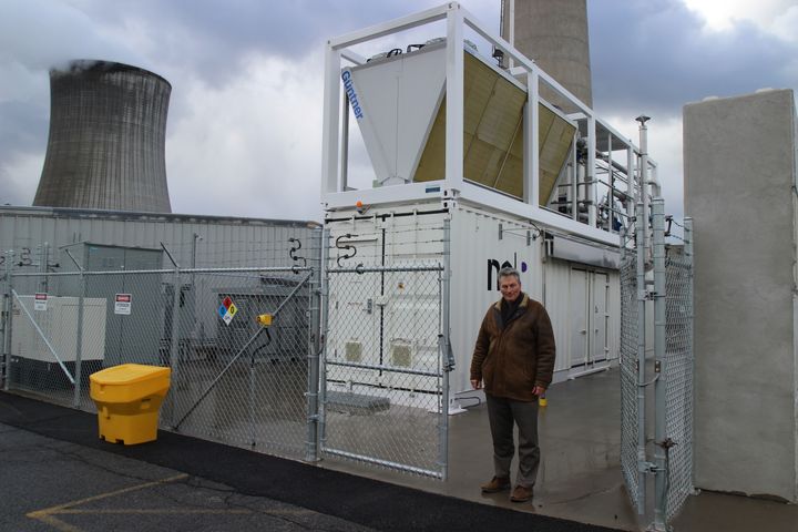 Robert Beaumont, the principal manager for Constellation's hydrogen project at Nine Mile Point, stands in front of the electrolyzer generating the fuel out of zero-carbon atomic electricity.