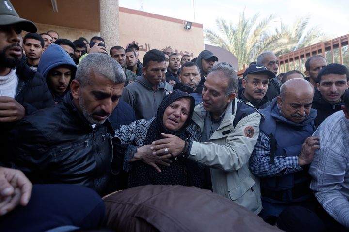 Relatives of the Al Jazeera cameraman, Samer Abu Daqqa, who was killed by an Israeli airstrike, mourn his death, during his funeral in the town of Khan Younis, southern Gaza Strip. Saturday, Dec. 16, 2023. (AP Photo/Mohammed Dahman)