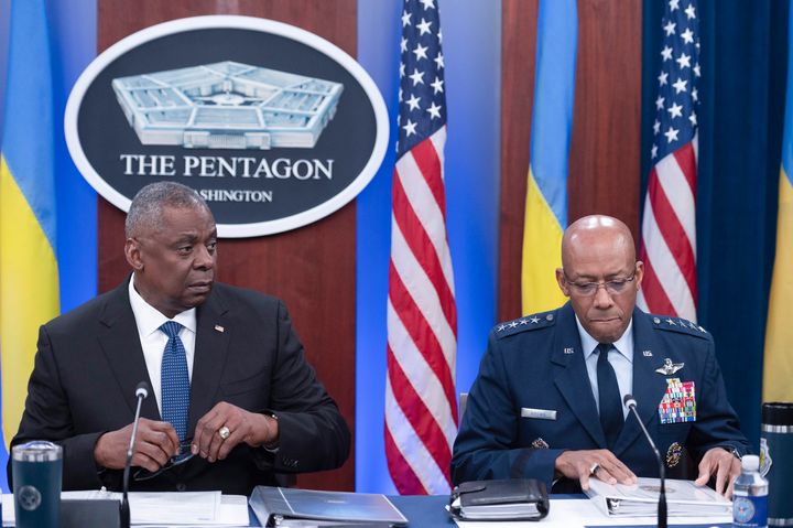 Secretary of Defense Lloyd Austin, left, and Chairman of the Joint Chiefs of Staff Air Force Gen. CQ Brown, participates in a virtual Ukraine Defense Contact Group (UDCG) meeting, Wednesday, Nov. 22, 2023, at the Pentagon in Washington. (AP Photo/Cliff Owen)