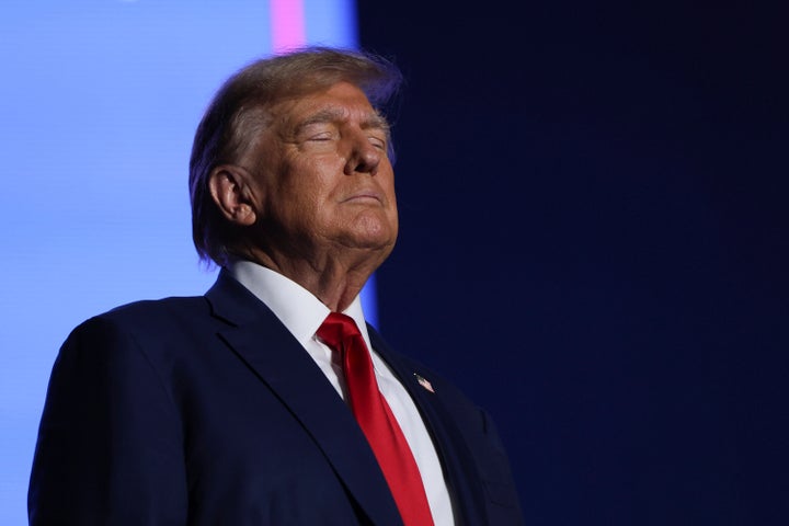 Former President Donald Trump greets the crowd at a campaign rally Saturday Dec. 16, 2023, in Durham, N.H. (AP Photo/Reba Saldanha)