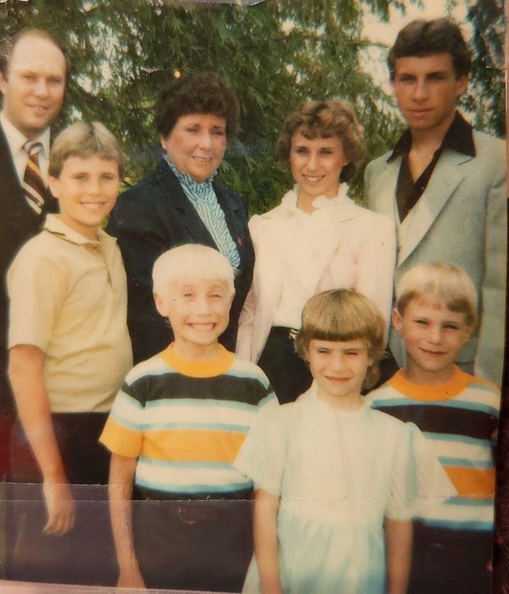 The author (back row, second from right) with her family in 1983. "I'm 12 in this photo," she writes. "This was six months after Mom stabbed Dad."