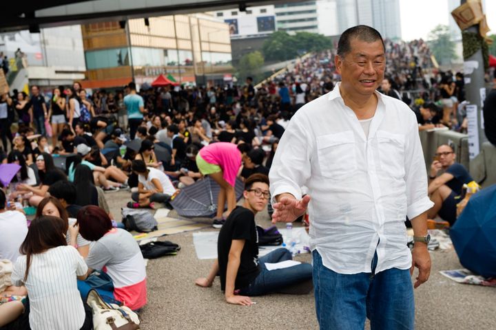 Lai stands in the crowd taking part in a sit-in called 'Occupy Central' or 'Umbrella revolution' in Hong Kong, 2014. 