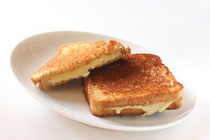 Spread the butter evenly on the bread for an even, golden crust.