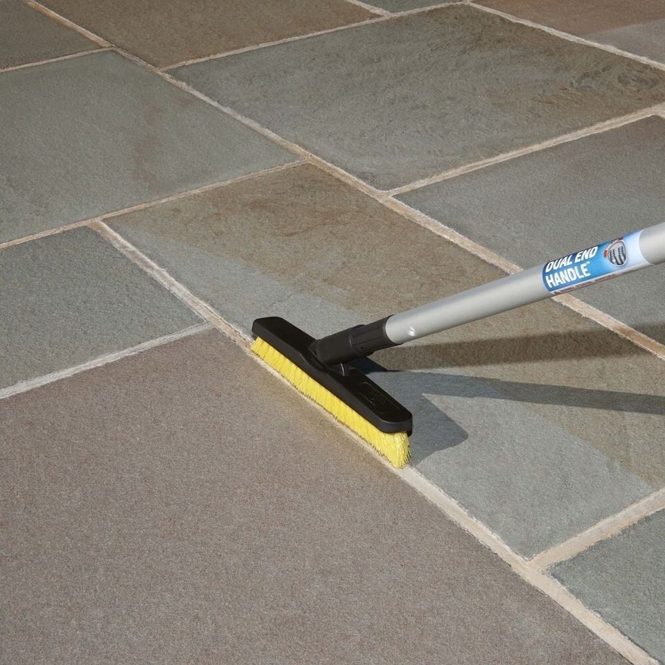 A swivel grout and corner brush