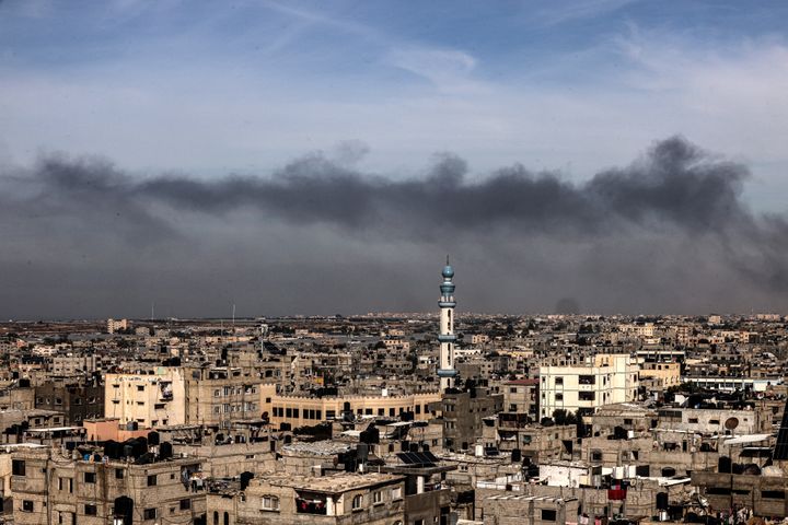 A picture taken from Rafah shows smoke billowing over Khan Yunis in the southern Gaza Strip during Israeli bombardment on December 20, 2023.
