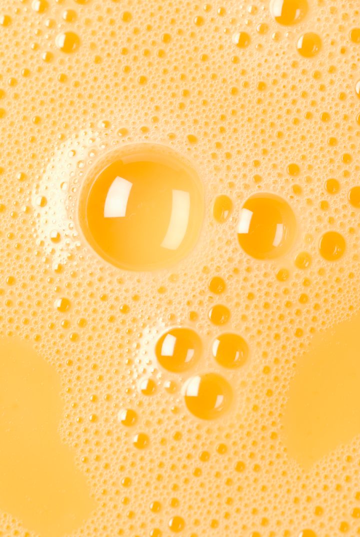 Close-up of beaten egg yolks with bubbles