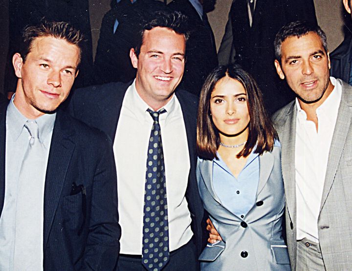 From Left: Mark Wahlberg, Perry, Salma Hayek and Clooney in 1998. The former "ER" star told Deadline he and Perry frequently played paddle tennis together as both their NBC shows were filmed at the same studio lot.