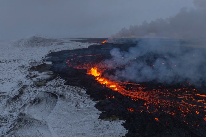 Aerial view of the only two segments of the fissure still active of an active volcano in Grindavik on Iceland's Reykjanes Peninsula, Tuesday, Dec. 19, 2023. (AP Photo/Marco Di Marco)