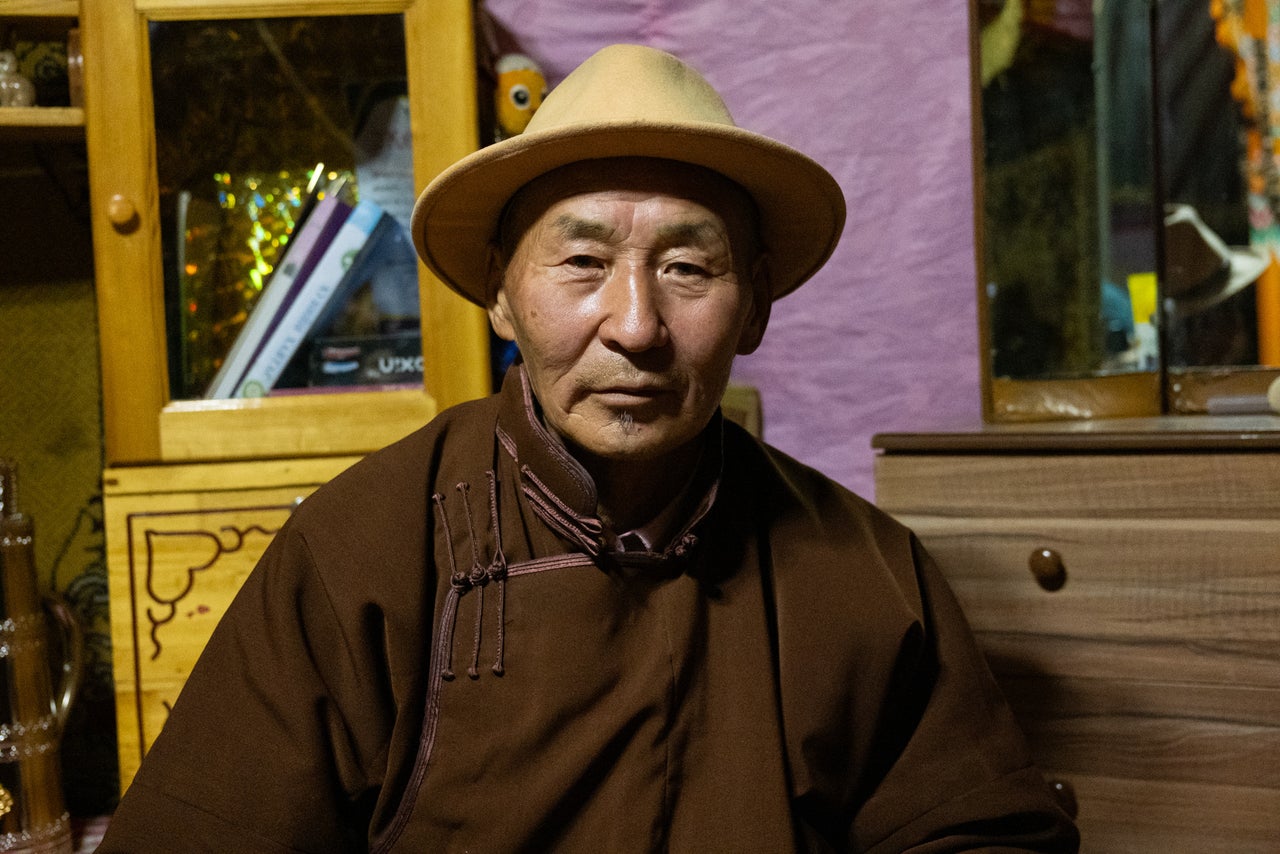 Sandag Damdinjav, 69, the patriarch of one of the more prominent herding families near Sant, sits in his children's ger after a family meal.