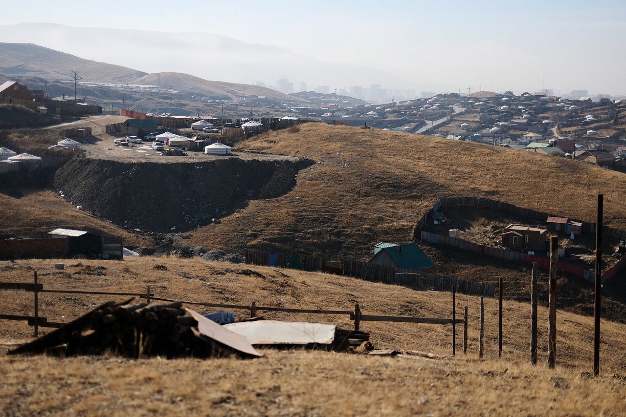 Not far from the hazy skyline of downtown Ulaanbaatar, ramshackle districts of ger tents are guarded by dogs.
