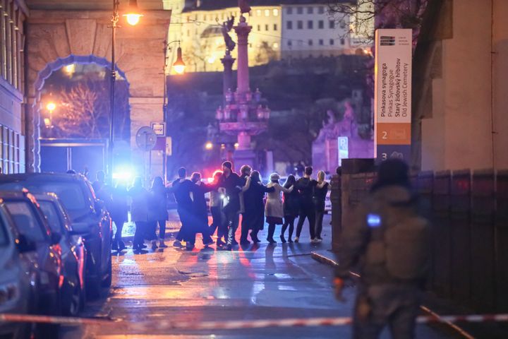 PRAGUE, CZECH REPUBLIC - DECEMBER 21: Students of Charles University are being evacuated by police at the location of the shooting on December 21, 2023 in Prague, Czech Republic. (Photo by Gabriel Kuchta/Getty Images)