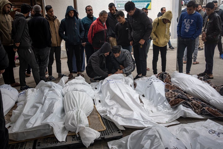 Palestinians mourn their relatives killed in the Israeli bombardment of the Gaza Strip, at the hospital Rafah, southern Gaza, on Dec. 21, 2023.