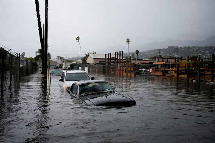 Cars are submerged on a flooded street during a rain storm on Dec. 21, 2023, in Santa Barbara, Calif. 