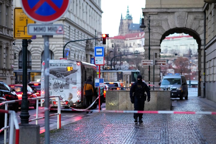 A policeman guards the area outside the building of Philosophical Faculty of Charles University Prague, Czech Republic, on Dec. 22, 2023.