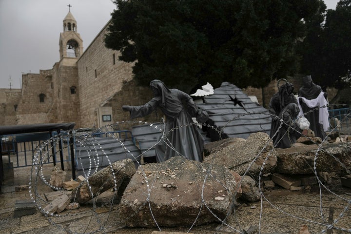 A nativity scene decorated to honor the victims in Gaza is displayed in Manger Square, near the Nativity Church, which is traditionally believed to be the birthplace of Jesus, on Christmas Eve, in the West Bank city of Bethlehem, Sunday, Dec. 24, 2023. (AP Photo/Mahmoud Illean)