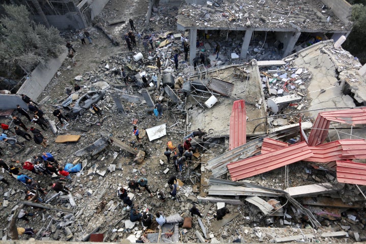 MAGHAZI, GAZA - DECEMBER 25: Search and rescue efforts for those trapped under rubble continue after Israeli airstrike hit civil residential area in al Maghazi refugee camp, Gaza on December 25, 2023. At least 70 people were killed in strikes in central Gaza's Maghazi refugee camp. (Photo by Ashraf Amra/Anadolu via Getty Images)