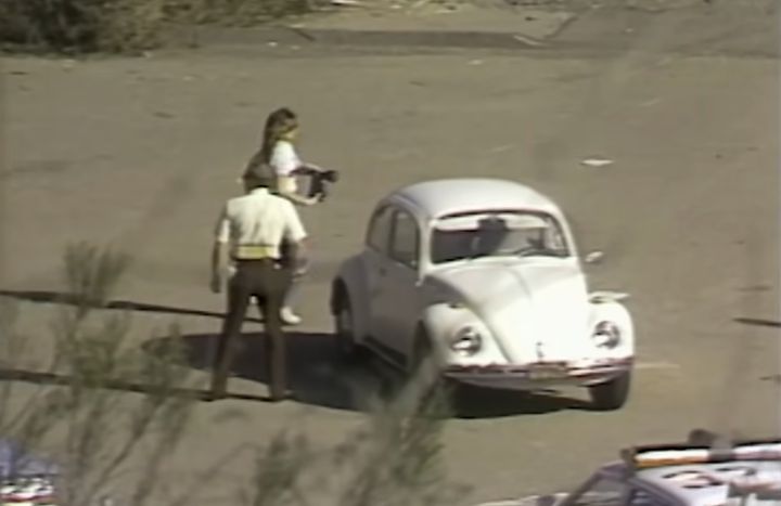 A crime scene investigator prepares to take photographs of Cara Knott's Volkswagen Beetle, which was found abandoned on Dec. 28, 1986.
