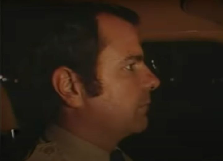 Craig Peyer is filmed by a local news team during a segment on traffic safety. Scratches that authorities believe Cara Knott inflicted before he killed her are visible on his nose.