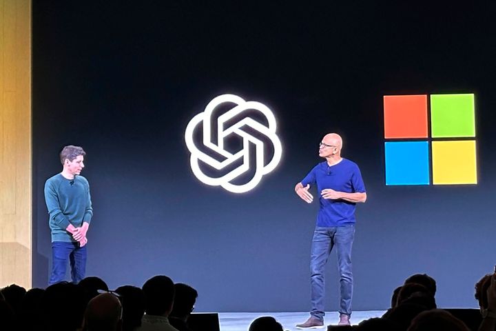 File - Sam Altman, left, appears onstage with Microsoft CEO Satya Nadella at OpenAI's first developer conference, on Nov. 6, 2023, in San Francisco. (AP Photo/Barbara Ortutay, File)