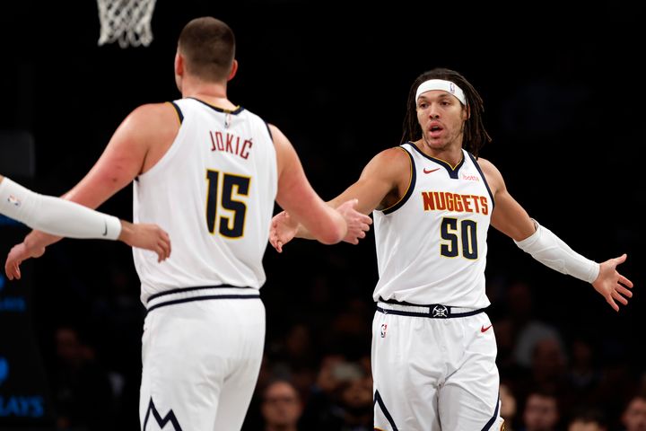 NEW YORK, NEW YORK - DECEMBER 22: Aaron Gordon #50 reacts with Nikola Jokic #15 of the Denver Nuggets during the first half against the Brooklyn Nets at Barclays Center on December 22, 2023 in the Brooklyn borough of New York City. (Photo by Sarah Stier/Getty Images)