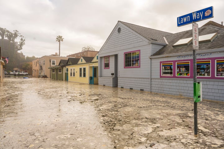 The streets are flooded in Capitola, Calif., Thursday, Dec. 28, 2023. Powerful surf is rolling onto beaches on the West Coast and Hawaii as a big swell generated by the stormy Pacific Ocean pushes toward shorelines. (AP Photo/Nic Coury)