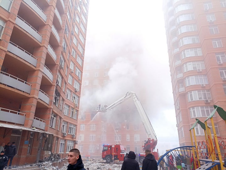 Firefighters work to extinguish a fire at a damaged apartment building after a Russian attack in Odesa, Ukraine, Friday, Dec. 29, 2023. (AP Photo/Artem Perfilov)