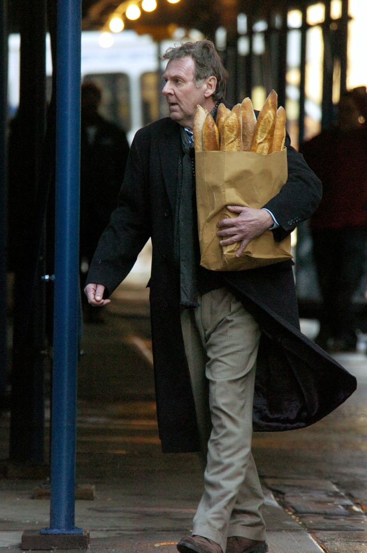 UNITED STATES - FEBRUARY 15: Actor Tom Wilkinson carries a bag of baguettes during filming of the movie "Michael Clayton" on Franklin St.in Tribeca. (Photo by Richard Corkery/NY Daily News Archive via Getty Images)