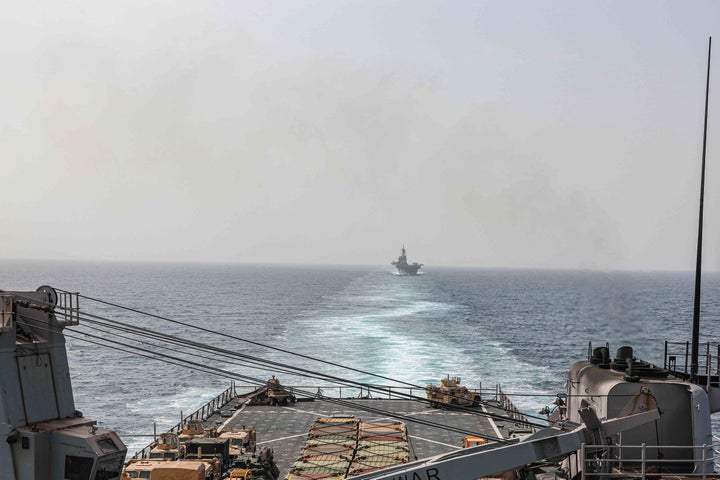 In this image provided by the U.S. Navy, the amphibious dock landing ship USS Carter Hall and amphibious assault ship USS Bataan transit the Bab al-Mandeb strait on Aug. 9, 2023. (Mass Communications Spc. 2nd Class Moises Sandoval/U.S. Navy via AP)