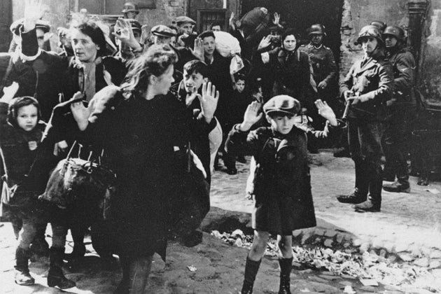 In this April 19, 1943, photo, Jews are forced from the Warsaw Ghetto by German soldiers.