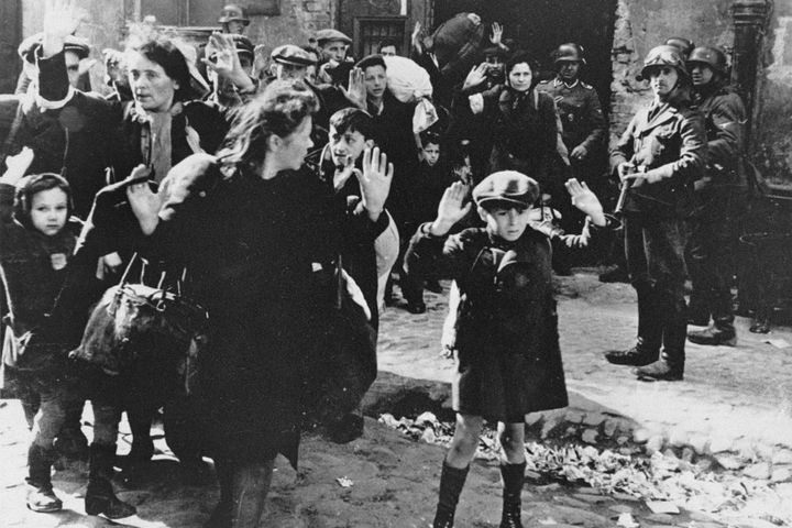 In this April 19, 1943, photo, Jews are forced from the Warsaw Ghetto by German soldiers.