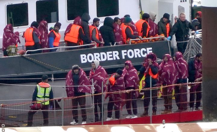 A group of people thought to be migrants are brought in to Dover, Kent, from a Border Force vessel in October last year.