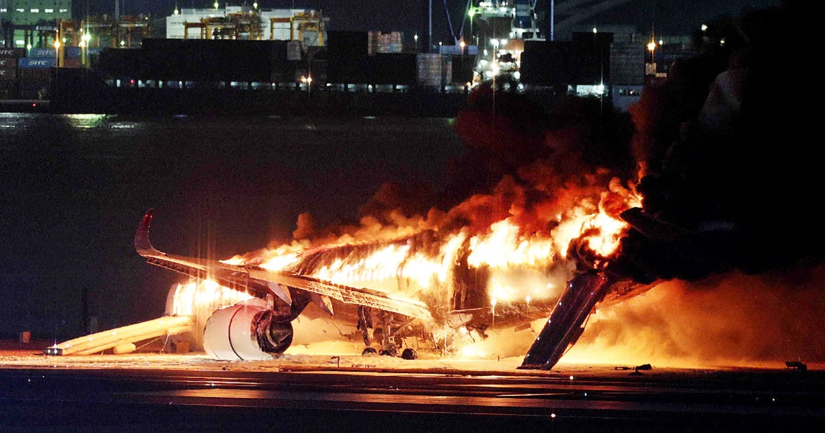 Plane Bursts Into Flames While Landing At Tokyo Airport