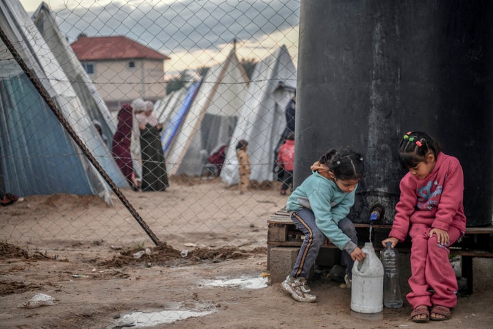 Displaced Palestinian families are packed into a tent city on Tuesday in Rafah, Gaza, where they took shelter from Israeli attacks.