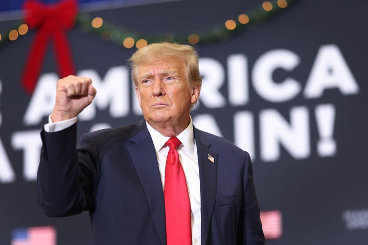 WATERLOO, IOWA - DECEMBER 19: Republican presidential candidate and former U.S. President Donald Trump gestures as he wraps up a campaign event on December 19, 2023 in Waterloo, Iowa. (Photo by Scott Olson/Getty Images)