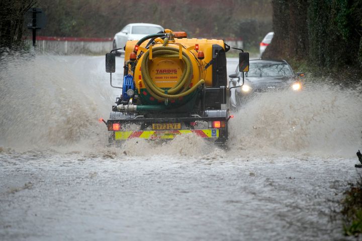 Motorists tackle a flooded road on January 02, 2024 in Ironbridge, England. 