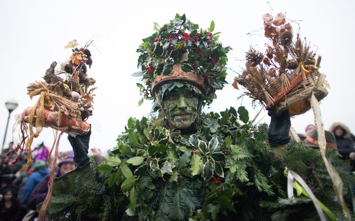 An actor dressed as a character from pagan myths during a performance in a folk play in celebration of Twelfth Night.