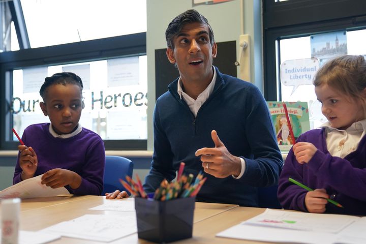 Rishi Sunak sits with school children as he visits Woodland View Primary School on in Sutton-in-Ashfield, Nottinghamshire.