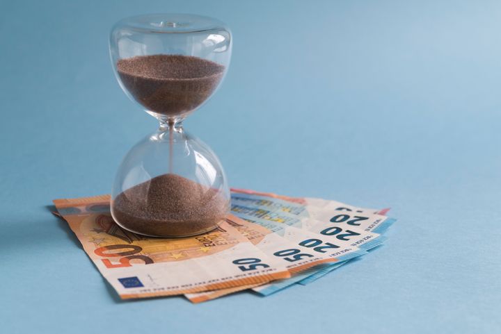 Hourglass on euro banknotes