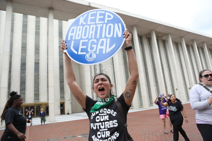 Faith Halstead chants along with other protesters and activists near the Florida State Capitol where Florida State Senators voted to pass a proposed six-week abortion ban in Tallahassee on April 3, 2023.