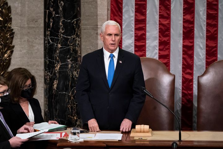Former Vice President Mike Pence returns to the House chamber after midnight, Jan. 7, 2021, to finish the work of the Electoral College after a mob loyal to President Donald Trump stormed the Capitol in Washington.